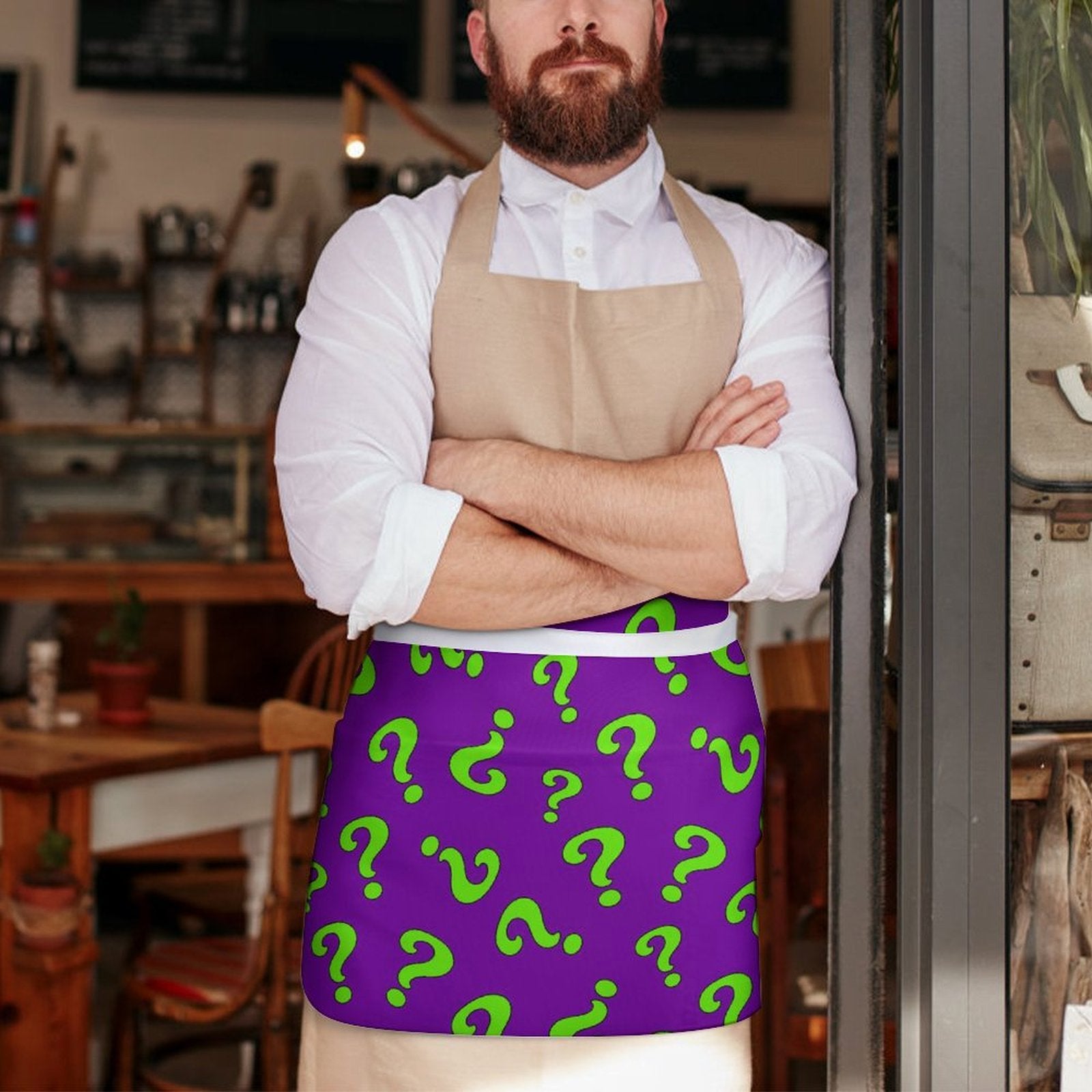 Magician wearing a purple apron with green question marks