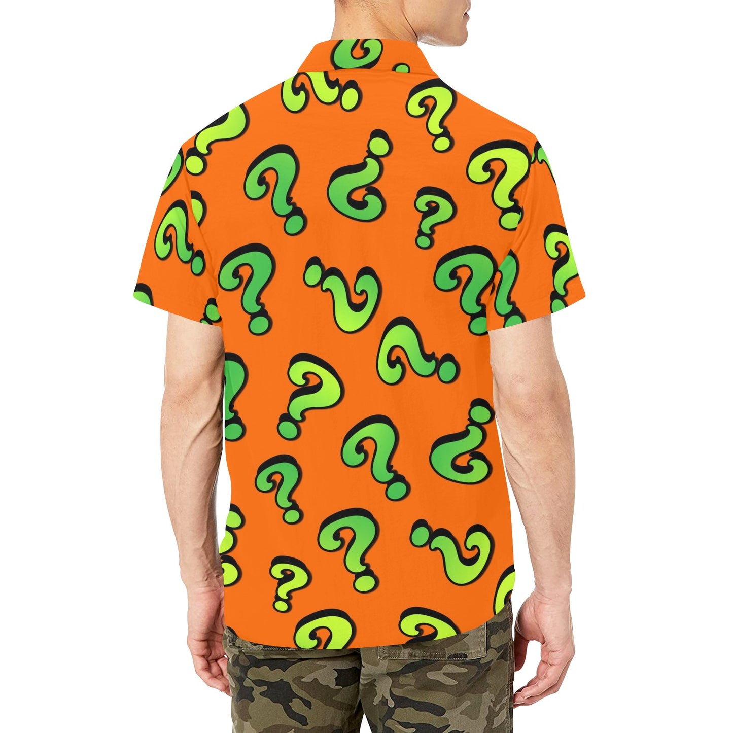 Orange shirt with green question mark pattern worn by an entertainer or magician