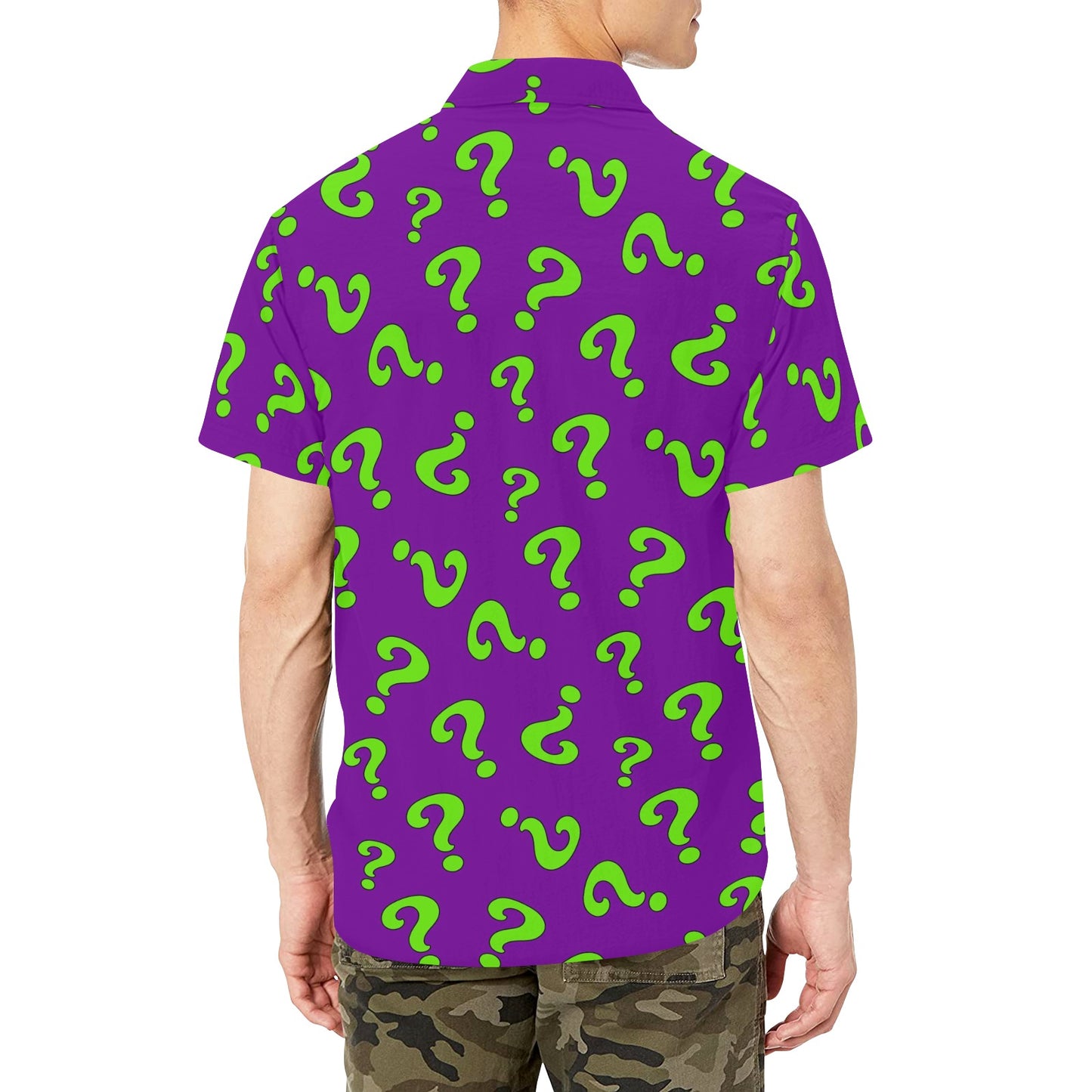 Purple shirt with green question marks worn by a person on a white background
