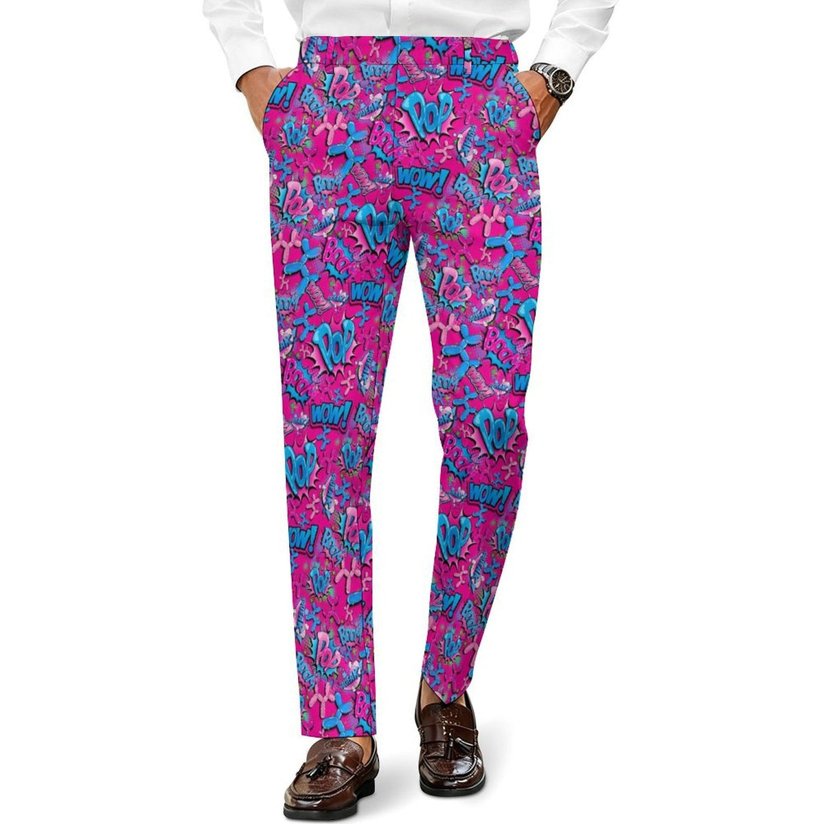 A person wearing bright pink and blue Balloon Dog patterned trousers, paired with a white shirt and brown loafers, shown from the waist down on a white background.