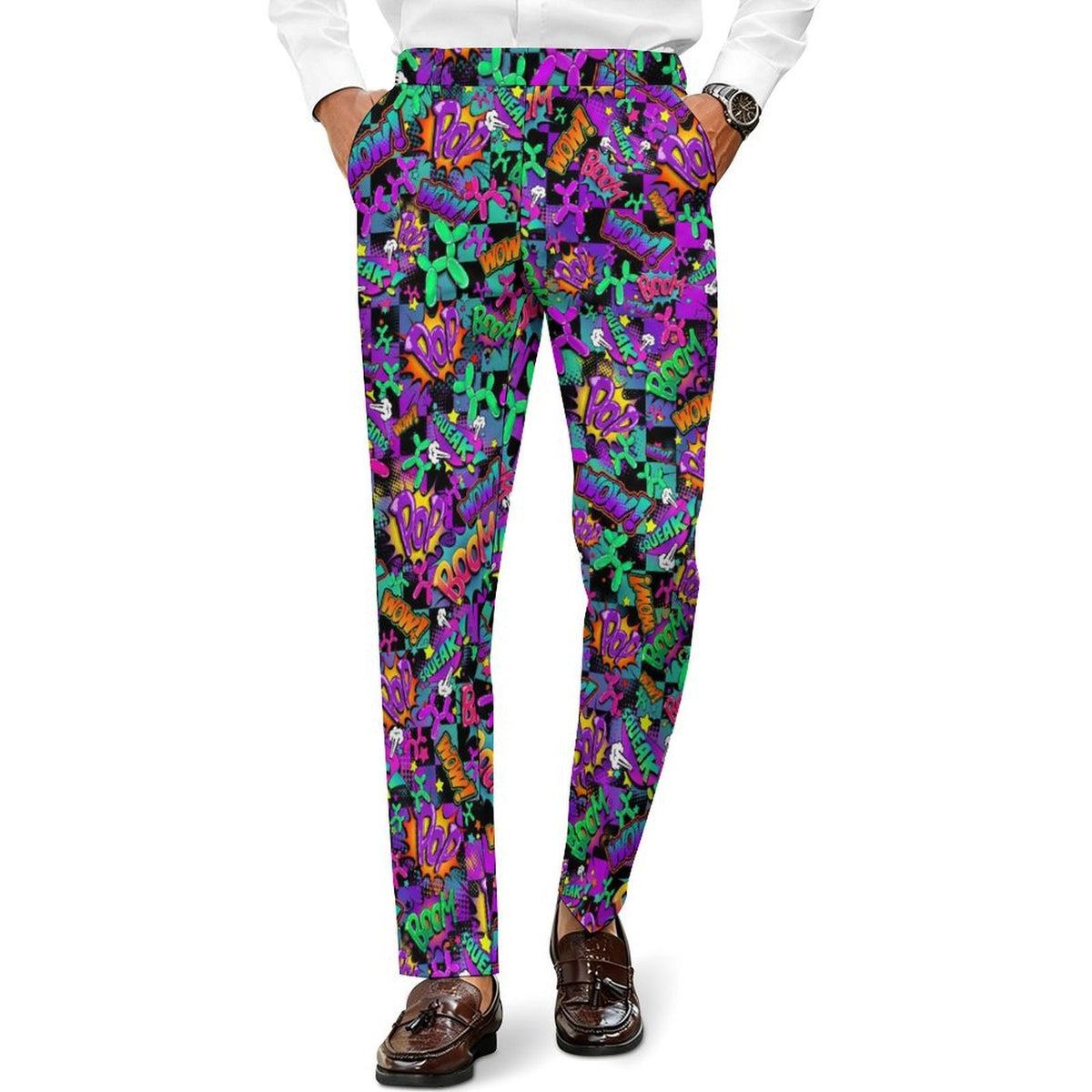 A person wearing slim-fit trousers with a vibrant, all-over psychedelic pattern of purple, green, orange, and black abstract shapes, styled with a white shirt and brown loafers against a plain white background.
