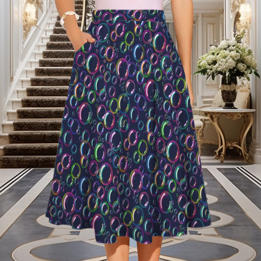 Person wearing a colorful bubble-patterned skirt in an elegant interior setting.