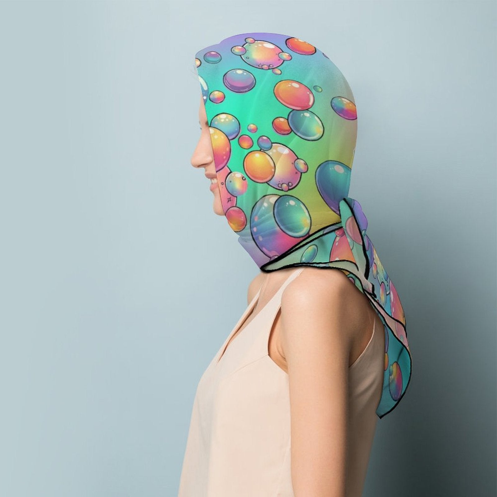 Person wearing a colourful bubble rainbow scarf