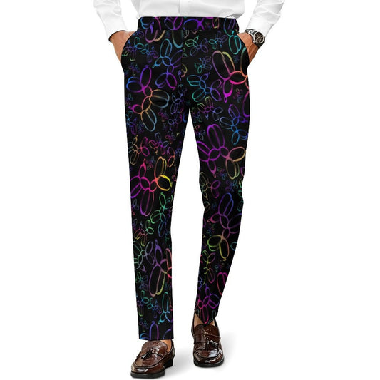 A person wearing slim black trousers with a colorful neon balloon-bloon pattern, paired with a white dress shirt and brown loafers, shown from the waist down on a white background.