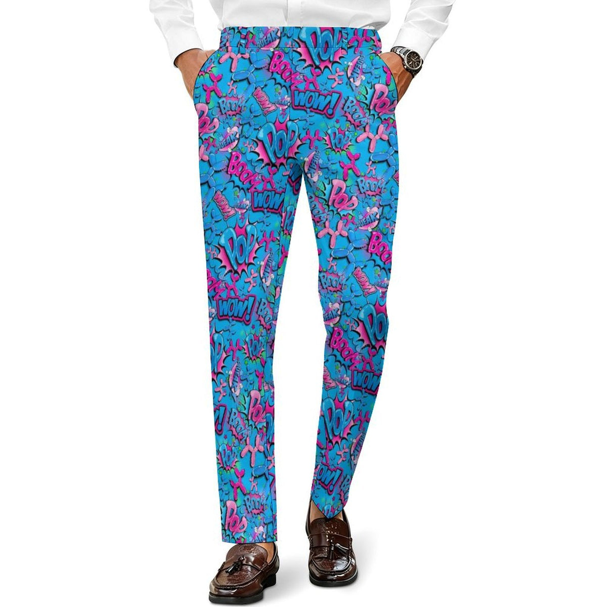A person wearing slim-fit trousers with a bold abstract graffiti-style Balloon Dog print in bright blue, pink, purple, and black, paired with a white shirt and brown loafers against a plain white background.