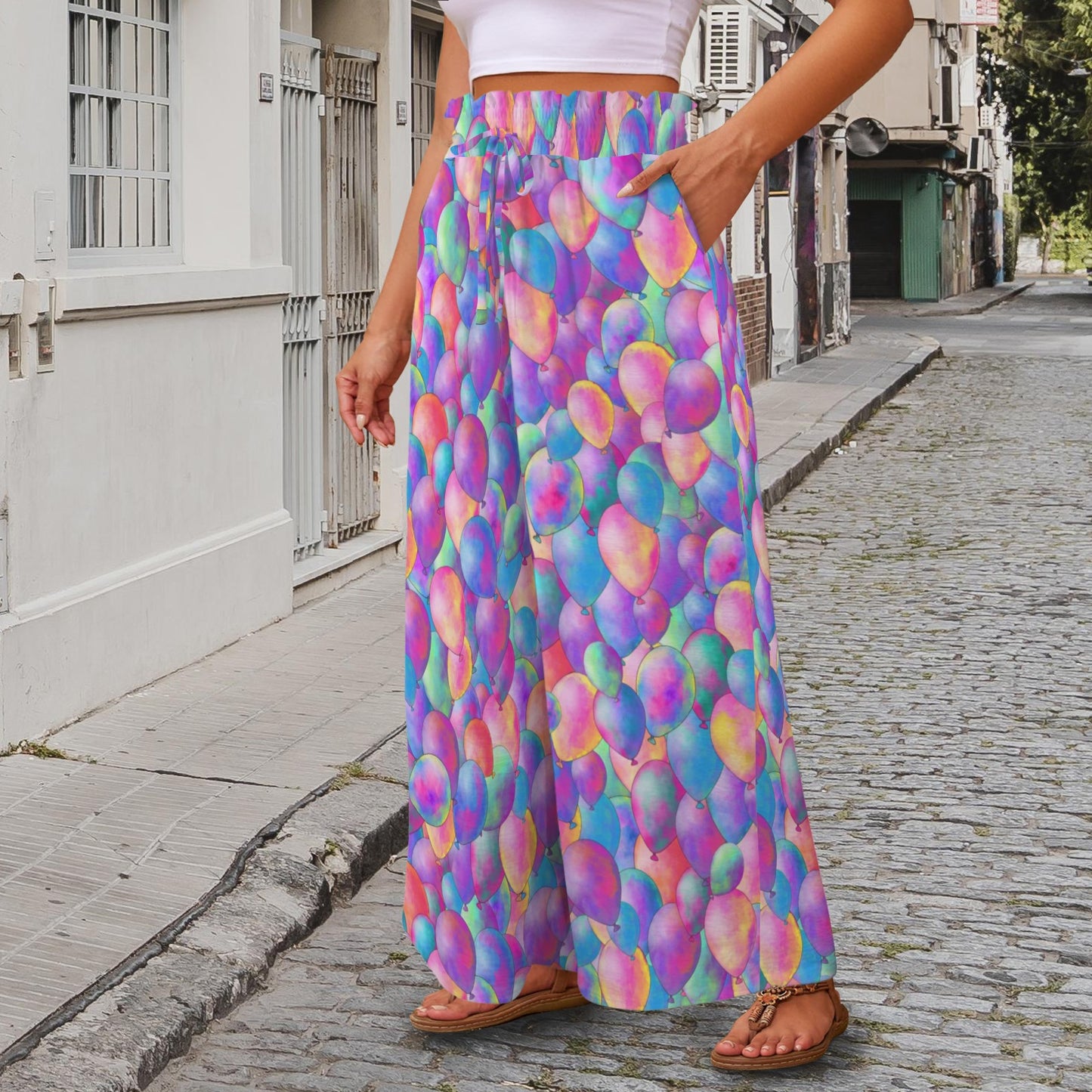 Person wearing colourful helium balloon pattern wide leg pants