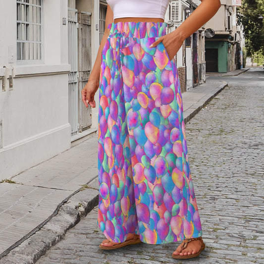 Person wearing colourful helium balloon pattern wide leg pants