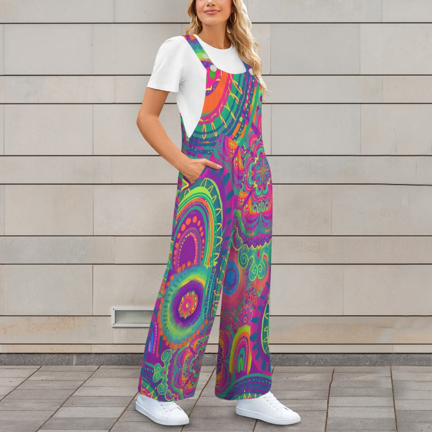 Person wearing a colorful psychedelic patterned jumpsuit against a wooden wall.
