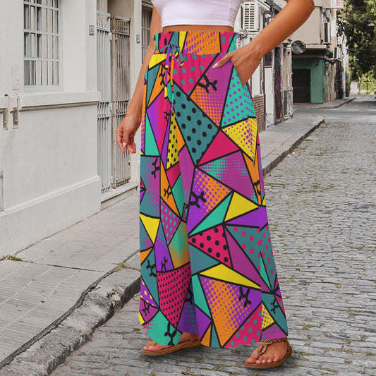 Person wearing colourful geometric-patterned pants with balloon dogs on a street.